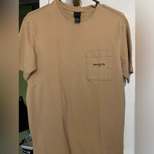 New York City shirt! Has a littler stain on top left shoulder.